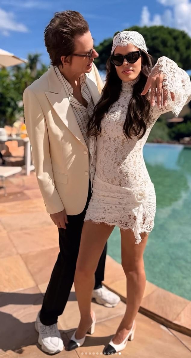 Atlanta proudly flashed her ring finger in a racy lace mini dress