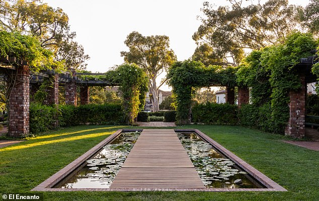A pond filled with lily pads enhances the peaceful ambiance