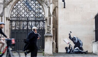Banksy unveils a new mural of a judge beating a protester outside London court