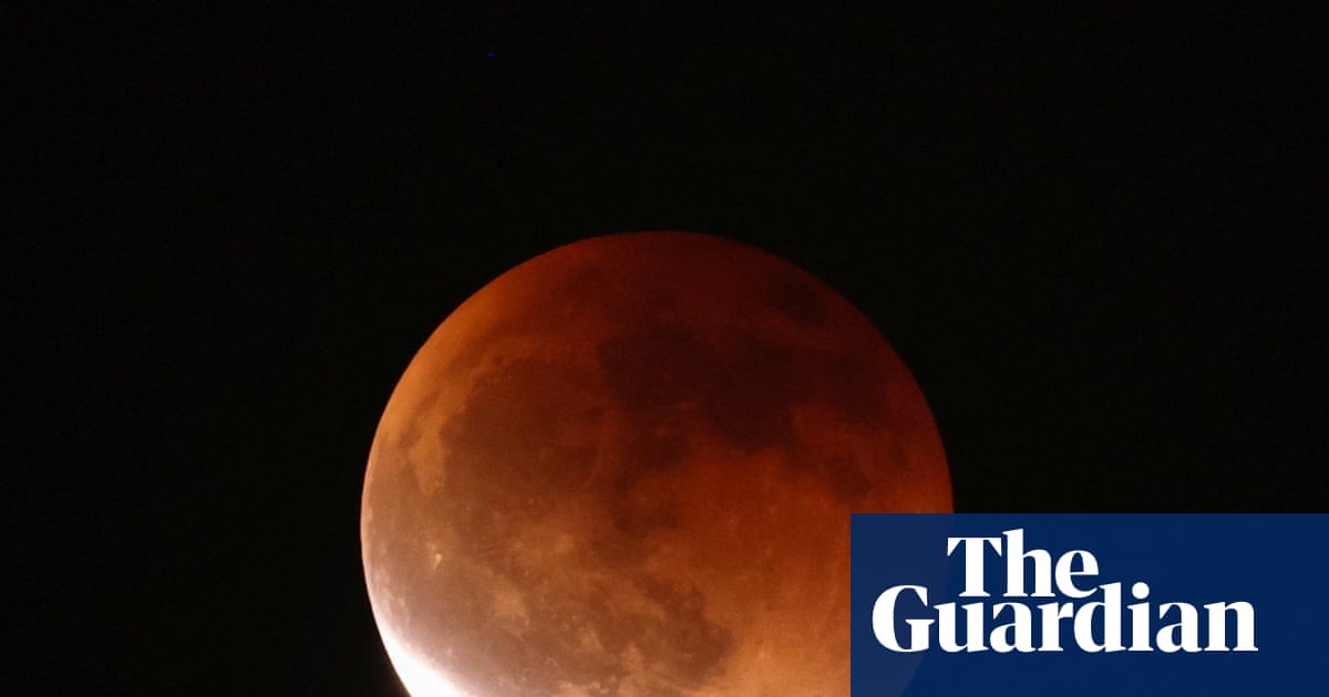 Blood moon and lunar eclipse cast an ethereal light – in pictures - The Guardian