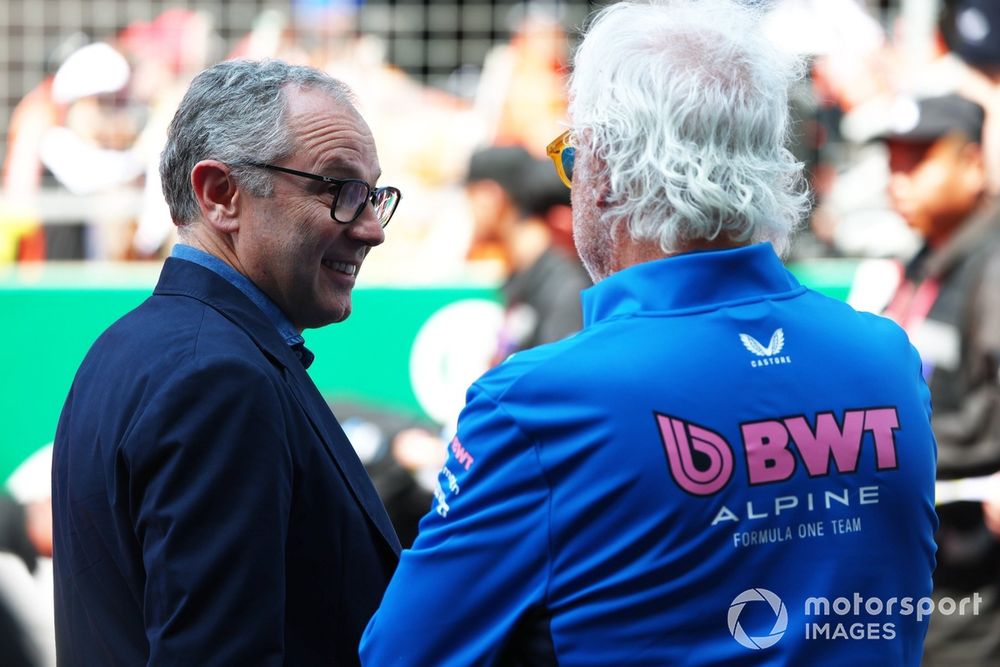 Stefano Domenicali, CEO of the Formula One Group talks with Flavio Briatore, Executive Advisor of Alpine F1 ahead of the tribute to the late Eddie Jordan