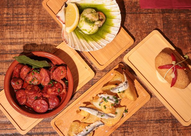 Tapas dishes include a sweet red pepper croquette, chorizo a la sidra and anchovies and potato chips