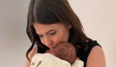 Aimee cuddles baby Charli