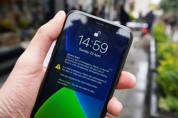 A test of a new public alert system on a mobile phone on Regent's Street in London