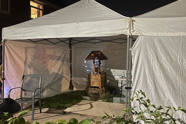 Inside one of the white tents is a well