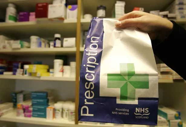 A prescription being picked up at a pharmacy