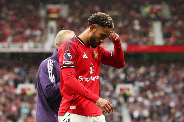 Matheus Cunha leaves the pitch following an injury during the Premier League match between Manchester United and Burnley at Old Trafford. 