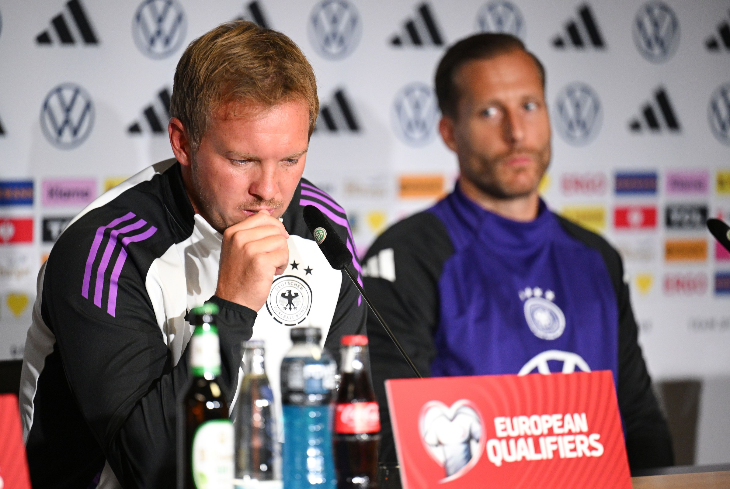 COLOGNE, GERMANY - SEPTEMBER 06: Julian Nagelsmann, head coach and Oliver Baumann of Germany talks to the media during the press conference of the German national football team at RheinEnergieStadion on September 06, 2025 in Cologne, Germany. (Photo by Stuart Franklin/Getty Images)