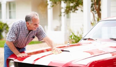 Retired man polishing vintage car