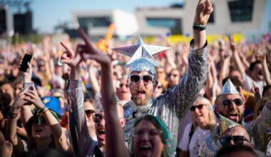 Eurovision fans enjoy the party atmosphere as they gather in Liverpool to watch the Eurovision Song Contest final on a giant screen in the Eurovision Village on May 13, 2023