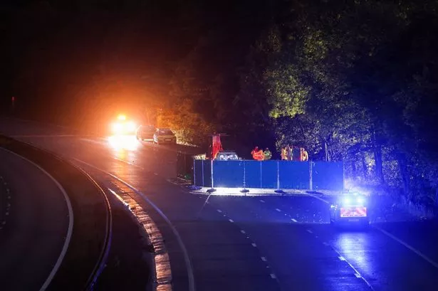Police remain at the scene on the M57 this evening