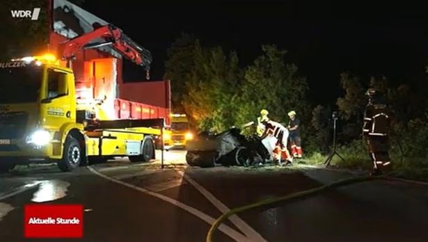 The heroic shop-owner desperately tried to free a man and two children from a burning Tesla 