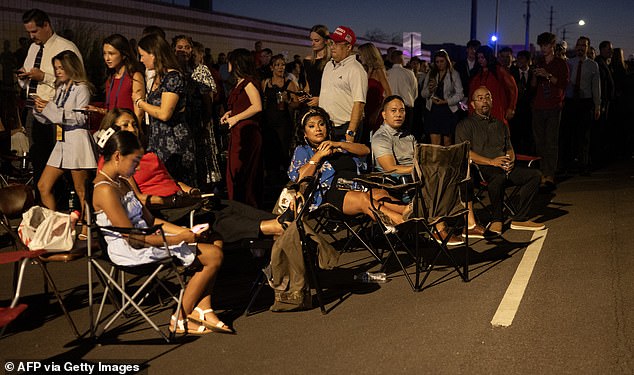 People arrive to attend the public memorial service of right-wing activist Charlie Kirk outside State Farm stadium in Glendale, Arizona, on September 21, 2025. (Photo by ANDREW CABALLERO-REYNOLDS / AFP) (Photo by ANDREW CABALLERO-REYNOLDS/AFP via Getty Images)