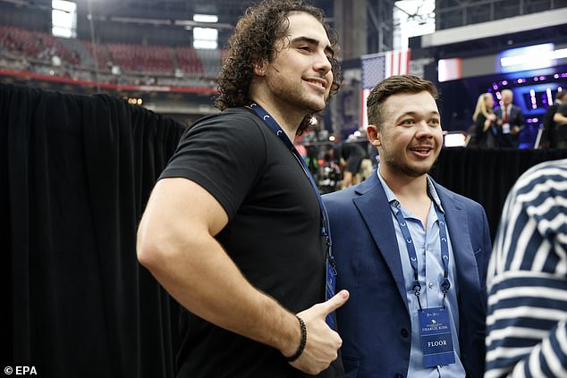 epa12396259 Kyle Rittenhouse (R) poses for a photo with an attendee during the public memorial service of political activist Charlie Kirk at State Farm Stadium in Glendale, Arizona, USA, 21 September 2025. Kirk was shot and killed on 10 September during a stop on his American Comeback Tour organized by Turning Point USA at Utah Valley University.  EPA/CAROLINE BREHMAN