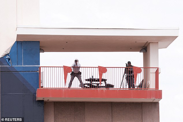 Members of a sniper team keep a lookout, on the day of a memorial service for slain conservative commentator Charlie Kirk in State Farm Stadium, in Glendale, Arizona, U.S., September 21, 2025.Â  REUTERS/Cheney Orr