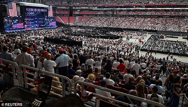 People gather to attend a memorial service for slain conservative commentator Charlie Kirk at State Farm Stadium, in Glendale, Arizona, U.S., September 21, 2025. REUTERS/Caitlin O'Hara