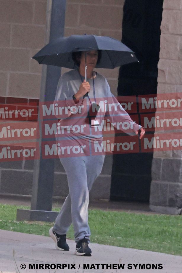 Maxwell walking in her prison clothes