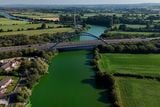 thumbnail: Blue-green algae on the River Bann where it meets Lough Neagh near the village of Toome. Niall Carson/PA Wire