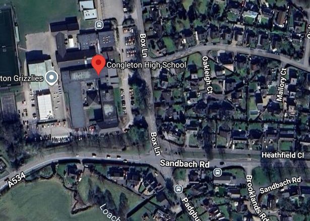 A grey Audi SUV was seen approaching students at a bus stop near the gates, according to police