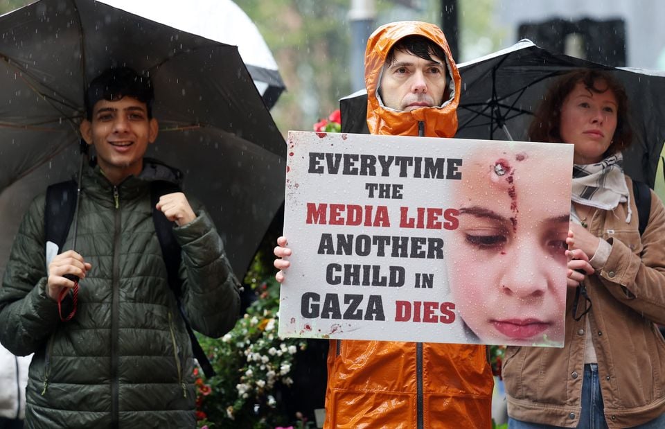 Pro-Palestinian protesters gather outside the BBC Northern Ireland office on Bedford Street in Belfast city centre. Picture by Jonathan Porter/PressEye