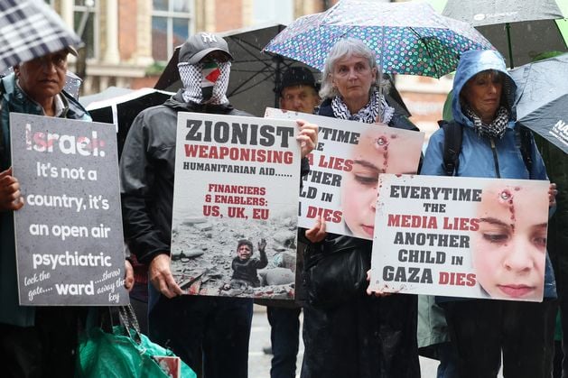 Pro-Palestine protestors gather outside BBC in Belfast