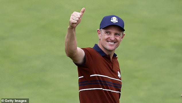 FARMINGDALE, NEW YORK - SEPTEMBER 27: Justin Rose of Team Europe acknowledges the crowd on the 18th hole green after Team Europe won three of four matches during the Saturday afternoon four-balls matches of the 2025 Ryder Cup at Black Course at Bethpage State Park Golf Course on September 27, 2025 in Farmingdale, New York. (Photo by Harry How/Getty Images)