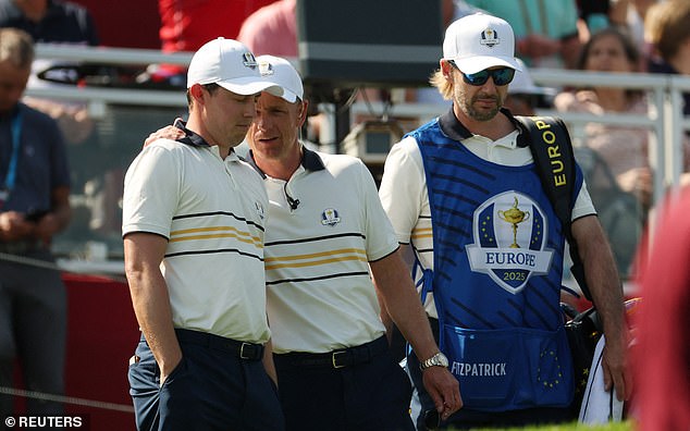 Golf - The 2025 Ryder Cup - Bethpage Black Golf Course, Farmingdale, New York, United States - September 28, 2025 Team Europe captain Luke Donald speaks with Matt Fitzpatrick on the 1st hole during the singles REUTERS/Brendan Mcdermid