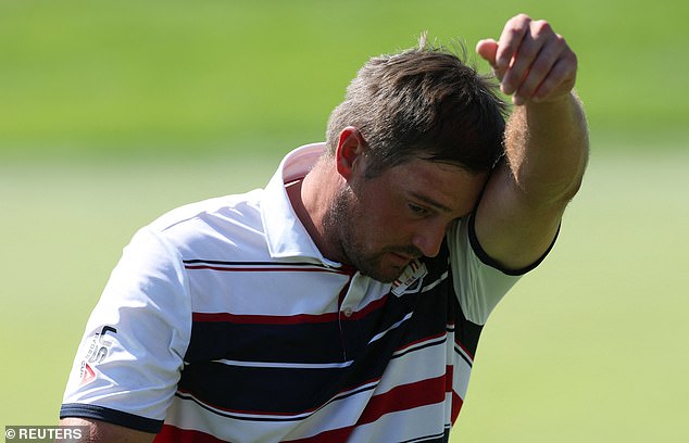 Golf - The 2025 Ryder Cup - Bethpage Black Golf Course, Farmingdale, New York, United States - September 28, 2025 Team USA's Bryson DeChambeau looks dejected after Team Europe win the hole on the 5th hole during the singles REUTERS/Paul Childs