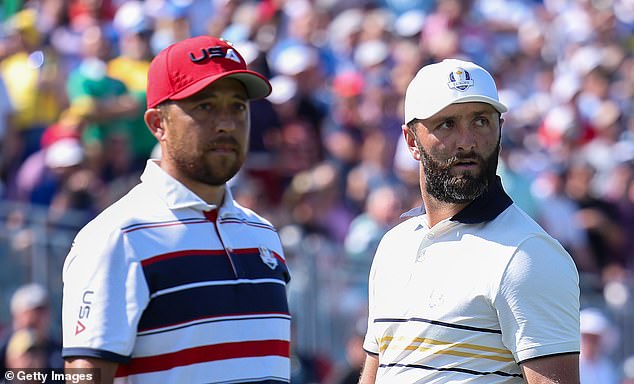 FARMINGDALE, NEW YORK - SEPTEMBER 28: (L-R) Xander Schauffele of Team United States and Jon Rahm of Team Europe look on from the first tee during the Sunday singles matches of the 2025 Ryder Cup at Black Course at Bethpage State Park Golf Course on September 28, 2025 in Farmingdale, New York. (Photo by Andrew Redington/Getty Images)