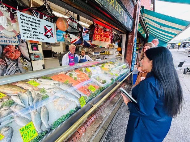 Council leader Arooj Shah at Crossley's Fish Stall at the Tommyfield Market.