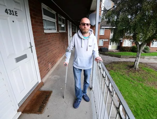Wayne Berry at his flat in Bootle