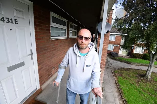 Wayne Berry at his flat in Bootle