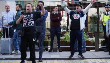 Police officer punched in face at anti-asylum protest in London