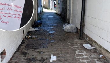 Rubbish and human waste piled outside a Helston barber