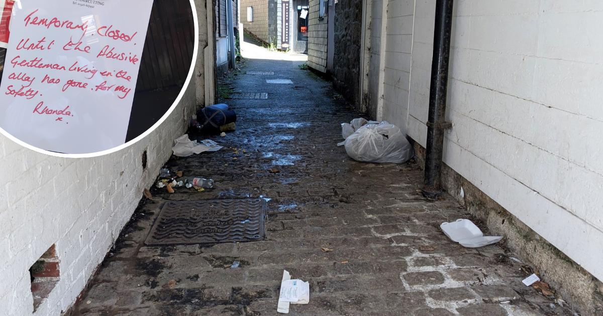 Rubbish and human waste piled outside a Helston barber
