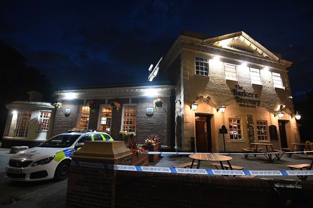 A cordon is in place outside the Barker's Brewery pub on Archway Road, Huyton