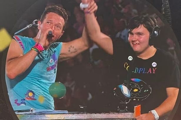Chris Martin and Walton DJ AJ Murphy on stage at the Coldplay Wembley gig on August 22 2025