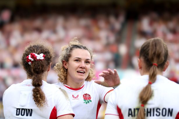 Ellie Kildunne celebrates with teammates Abby Dow and Holly Aitchison after England's Women's Rugby World Cup 2025 Semi Final match against France