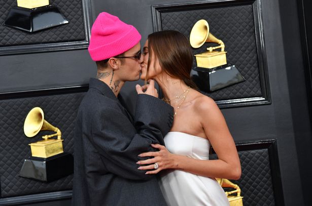 The superstar, pictured kissing wife Hailey, released new music recently