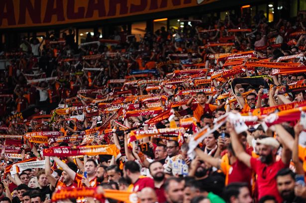 Galatasaray fans support their team during a Champions League match