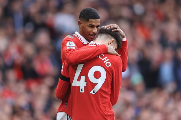 Alejandro Garnacho is embraced by Marcus Rashford as he wears the No.49 shirt for Manchester United