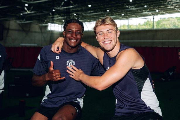 Patrick Dorgu and Rasmus Hojlund pictured at Carrington in July