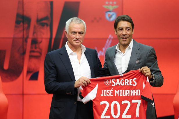 Jose Mourinho holds up a Benfica shirt alongside Rui Costa