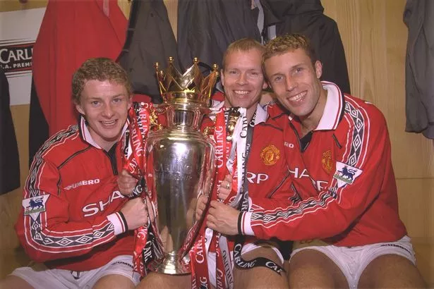 Ole Gunnar Solskjaer, Henning Berg and Ronny Johnson celebrate after winning the 1999 Premier League