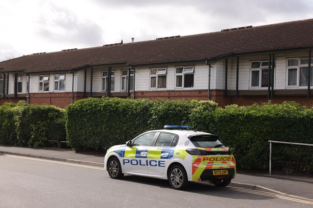 A police car at the scene outside The Laurels assisted living accommodation in Grange lane, Mere Green in Sutton Coldfield the day after a man's body was found 