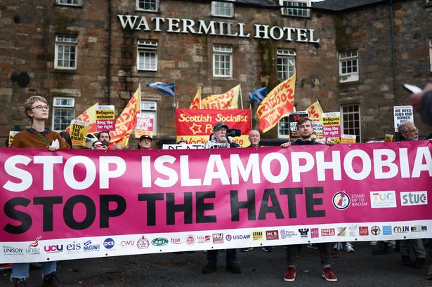 Stop the far right demonstrators hold a rally outside the Watermill Hotel in support of refugees on August 09, 2024 in Paisley, Scotland. 