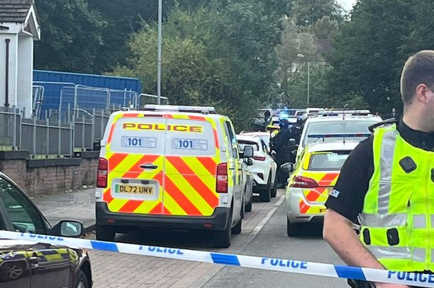 Cops sealed off the street as armed response vehicles arrived