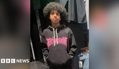 Mohanad Abdullaahi Goobe. He had black curly hair and was pictured wearing a dark hoodie with bright pink writing on it.