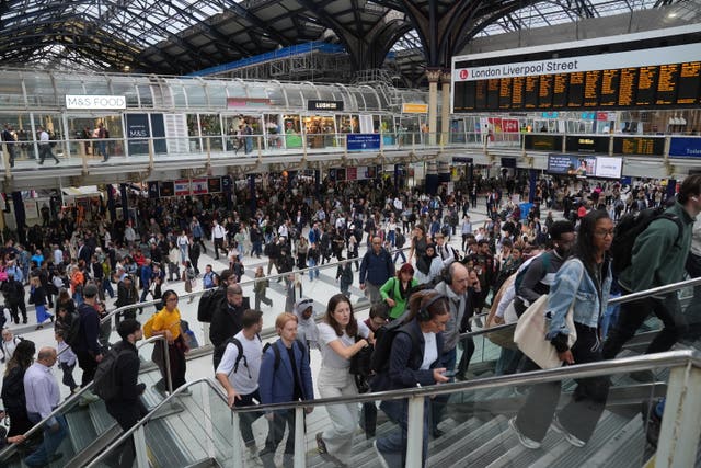 Passengers at Liverpool Street Station in London