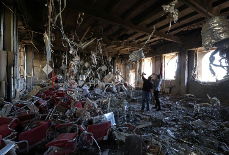 Local officials take pictures inside a school building that was damaged yesterday in what local authorities called a Ukrainian drone attack in the course of Russia-Ukraine conflict, in the town of Foros, Crimea September 22, 2025. REUTERS/Alexey Pavlishak TPX IMAGES OF THE DAY